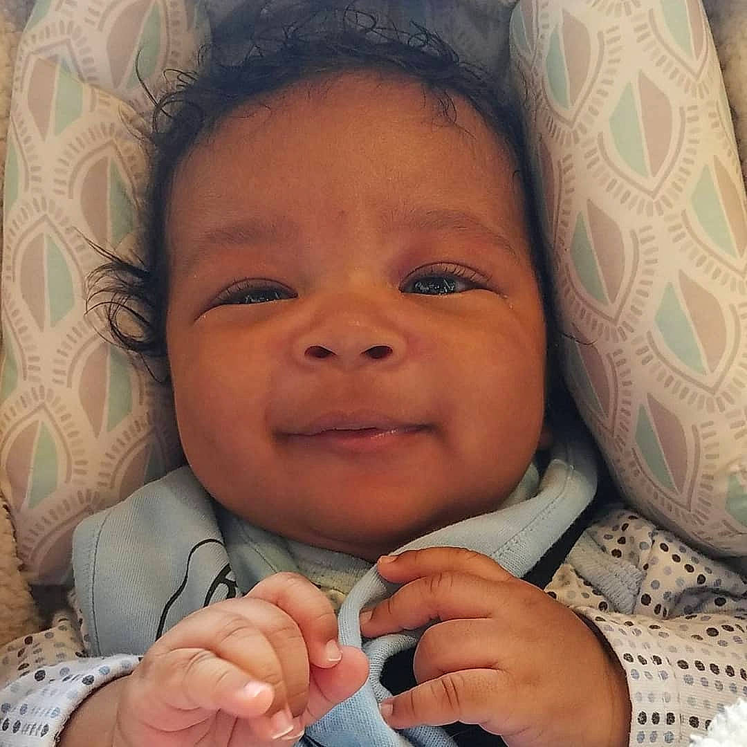 Castiel is registered to the contest to win money with this photo: baby, cheek, child, chin, eye, face, facial_expression, finger, forehead, hand, happy, head, human, lip, mouth, nose, person, skin, smile, thumb