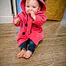 toddler, child, pink_hoodie, barefoot, wooden_floor, indoor, thumb_sucking, curious, floor, clothing, coat, baby, person, casual, cute, young_child, flooring, sock, paper_bag, portrait
