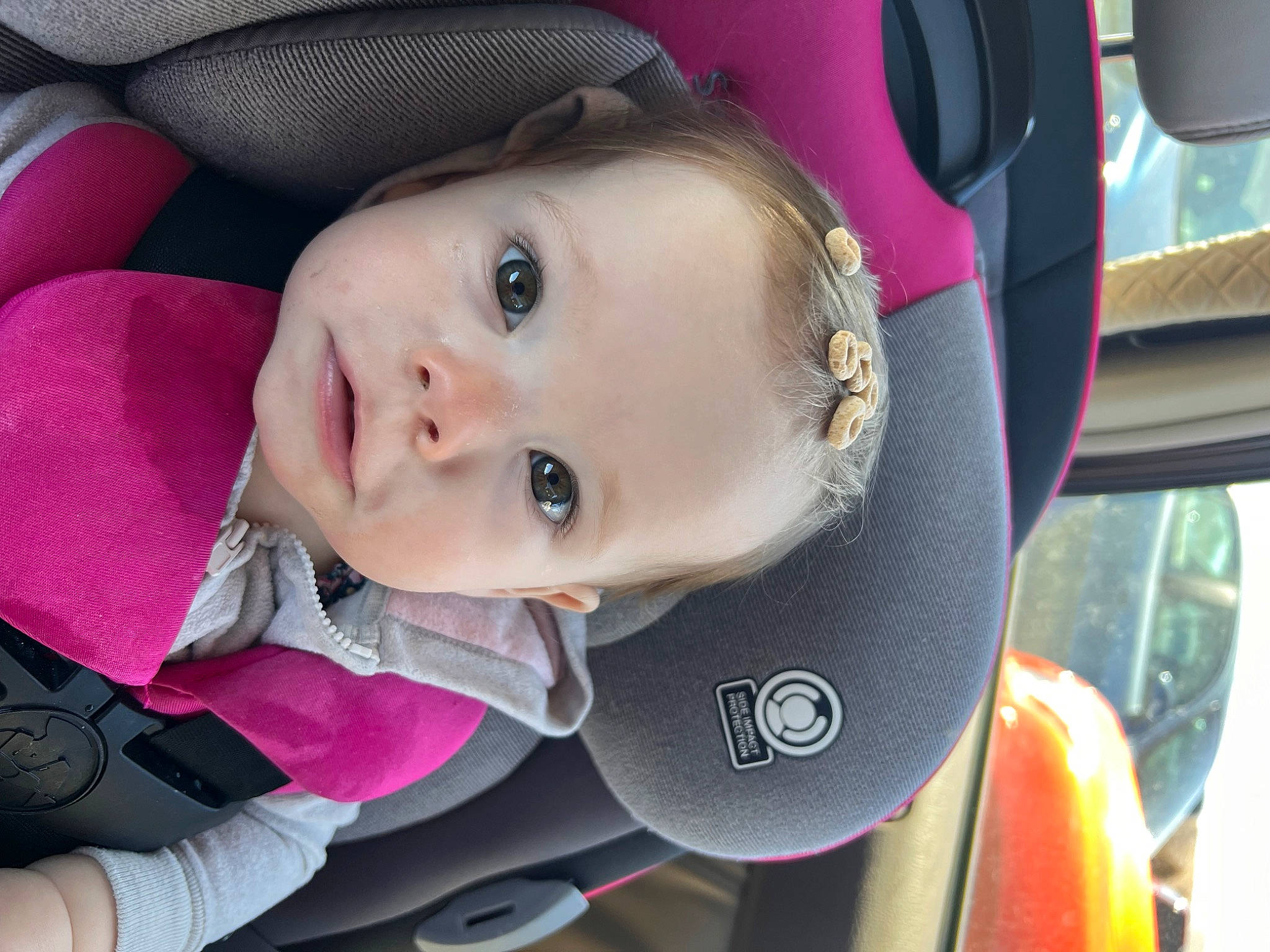 Izabella is registered to the contest to win money with this photo: auto_part, baby, baby_carriage, baby_products, car_seat, cheek, child, chin, eyebrow, face, fun, iris, lip, mouth, person, pink, seat_belt, skin, smile, toddler