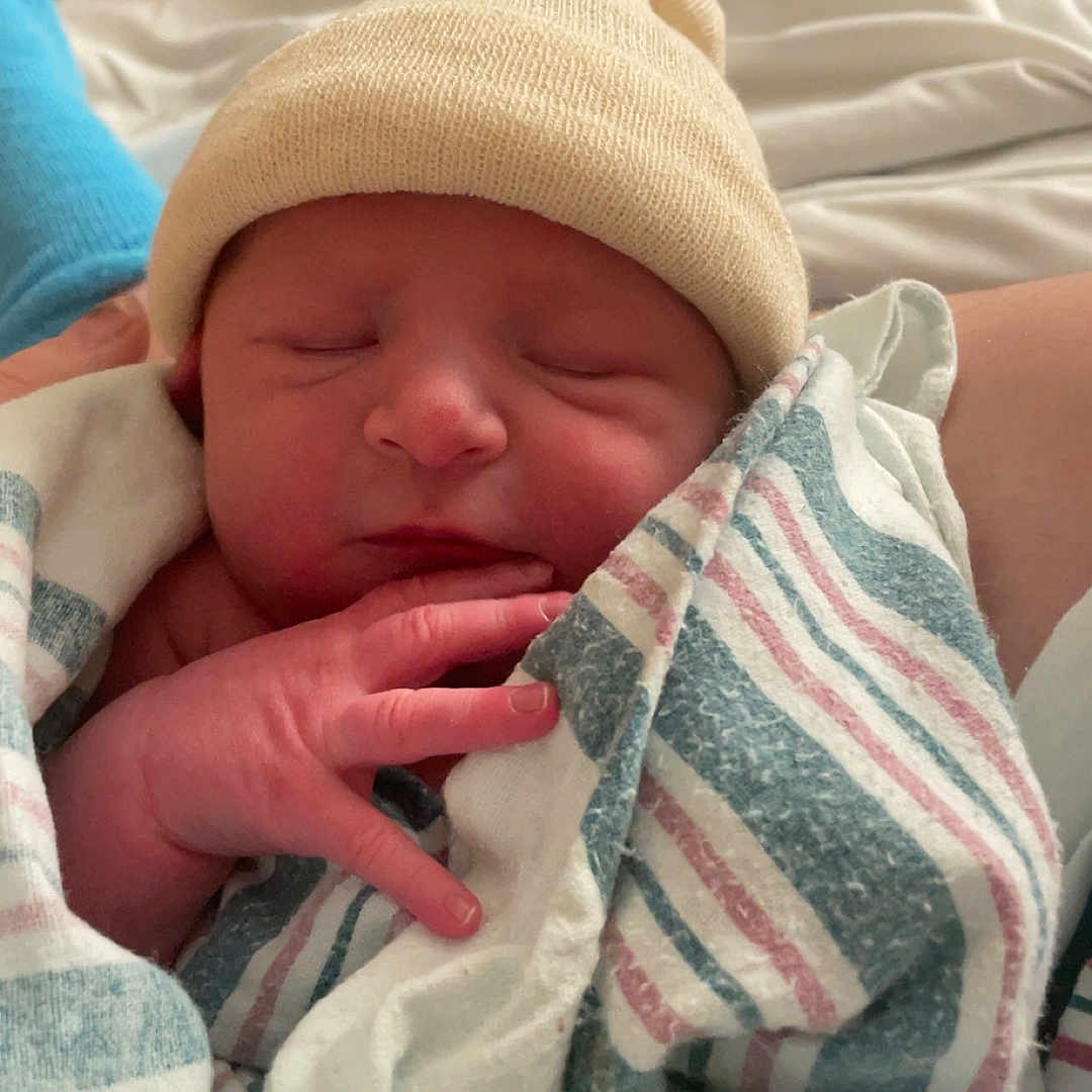 Klause joined the competition — help win amazing prizes! architecture, baby, bed, blanket, building, cap, clothing, cushion, face, furniture, glove, hat, head, hospital, newborn, person, photography, portrait, quilt, sleeping