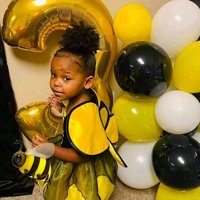 Anissa Brielle is registered to the contest to win money with this photo: balloon, child, event, facial_expression, fun, happy, inflatable, leisure, light, metal, organ, party_supply, person, photograph, recreation, sharing, snapshot, toddler, toy, white