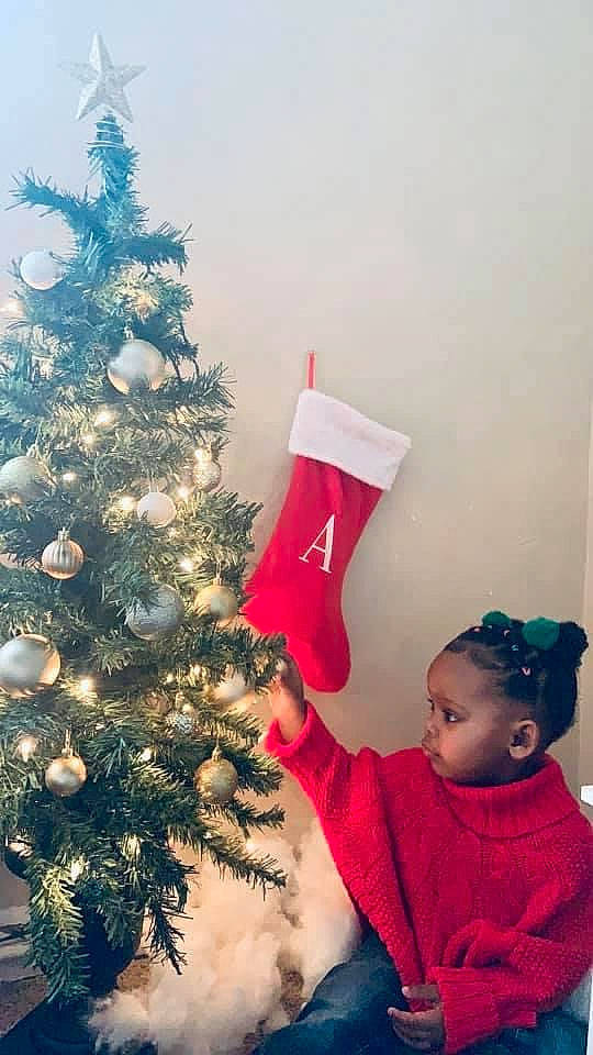Anissa Brielle joined the competition — help win amazing prizes! christmas, christmas_decoration, christmas_eve, christmas_ornament, christmas_tree, conifer, event, evergreen, happy, holiday, holiday_ornament, magenta, ornament, person, plant, room, sleeve, standing, toddler, tradition