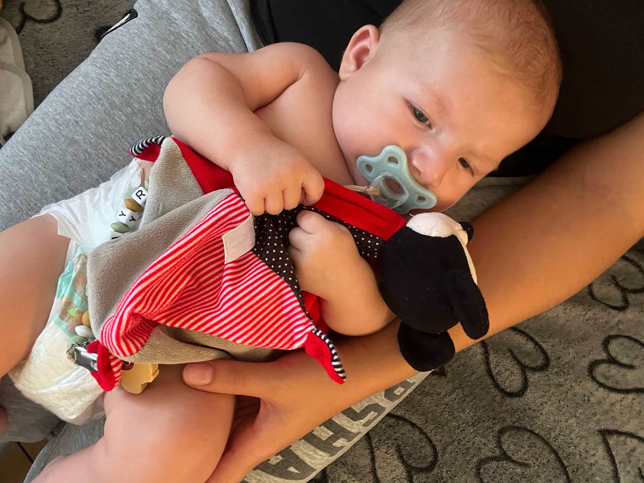 Mayron participe au concours pour gagner de l'argent avec cette photo : baby, baby_toddler_clothing, cheek, child, comfort, dress, eye, finger, happy, head, human_leg, iris, leg, lip, mouth, nail, pattern, person, skin, thigh