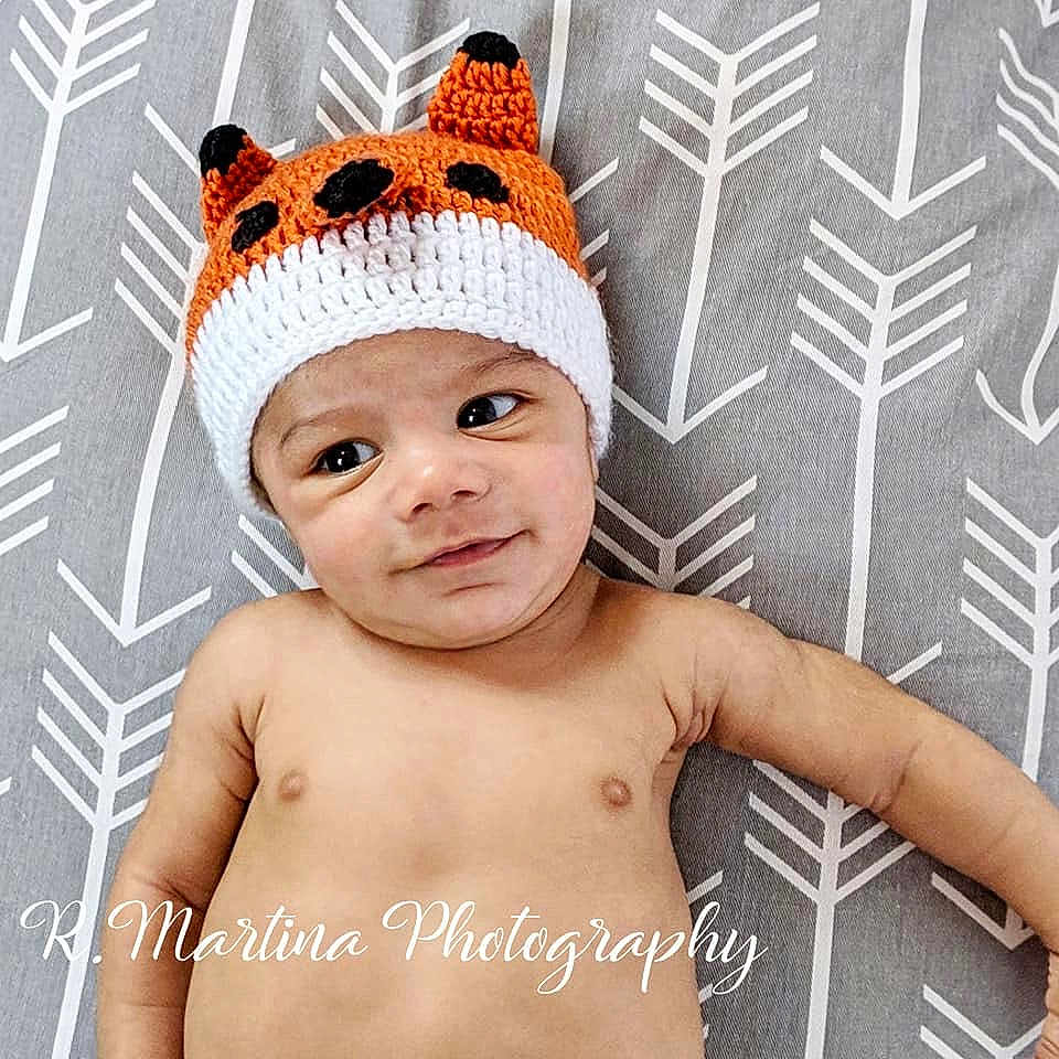 Mekhi is registered to the contest to win money with this photo: baby, baby_toddler_clothing, beanie, bonnet, cap, child, clothing, costume_accessory, crochet, crown, design, ear, fashion_accessory, font, hat, headgear, headwear, knit_cap, pattern, person
