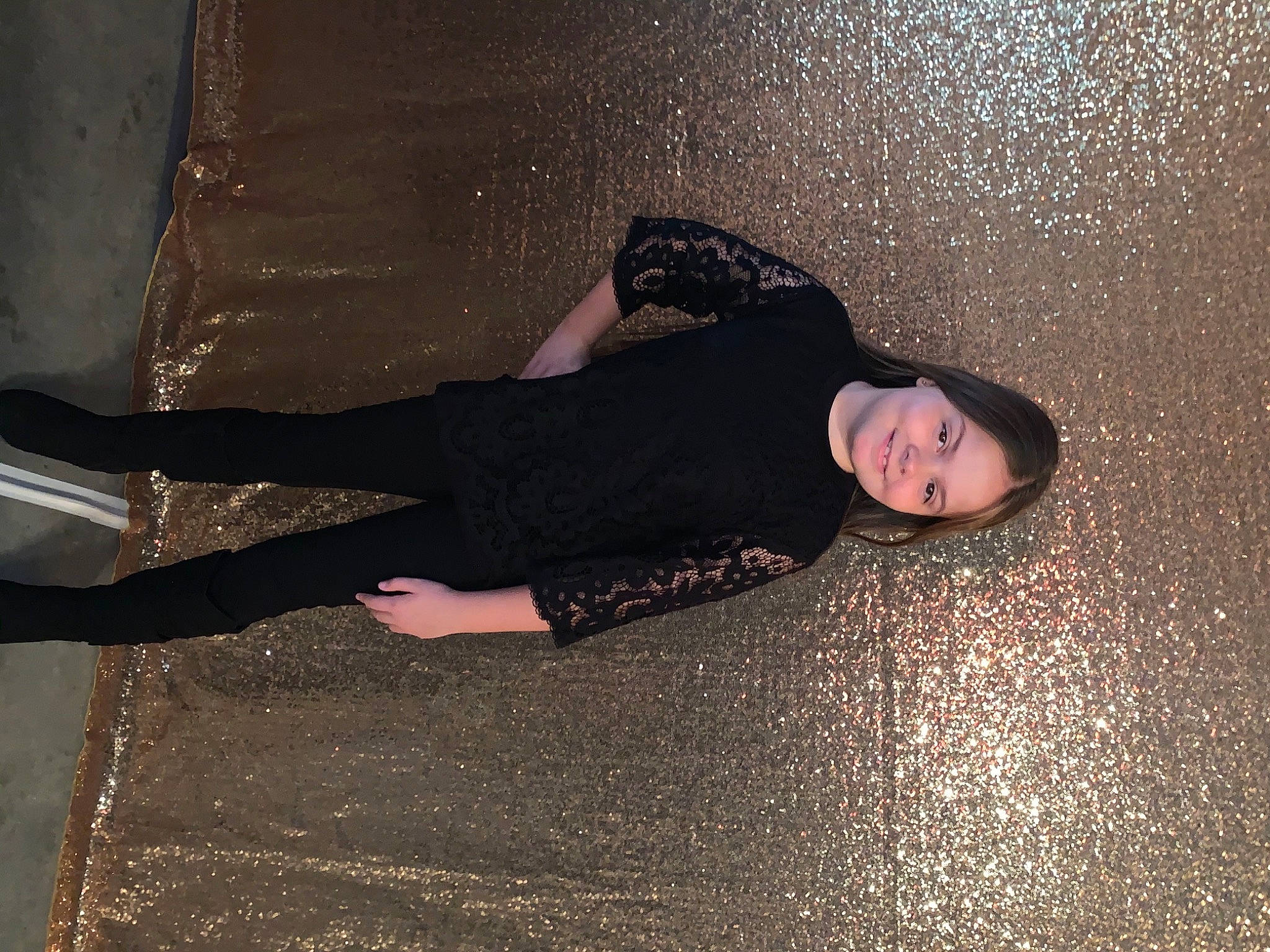 Madison is registered to the contest to win money with this photo: arm, cool, darkness, flash_photography, floor, flooring, foot, fun, hand, human_body, human_leg, joy, knee, leg, long_hair, person, road_surface, shadow, thigh, tints_and_shades