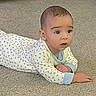 baby, infant, child, crawling, lying_down, carpet, indoor, portrait, face, eyes, curious, looking_at_camera, pajamas, patterned_clothing, blue, white, hands, floor, home, photograph