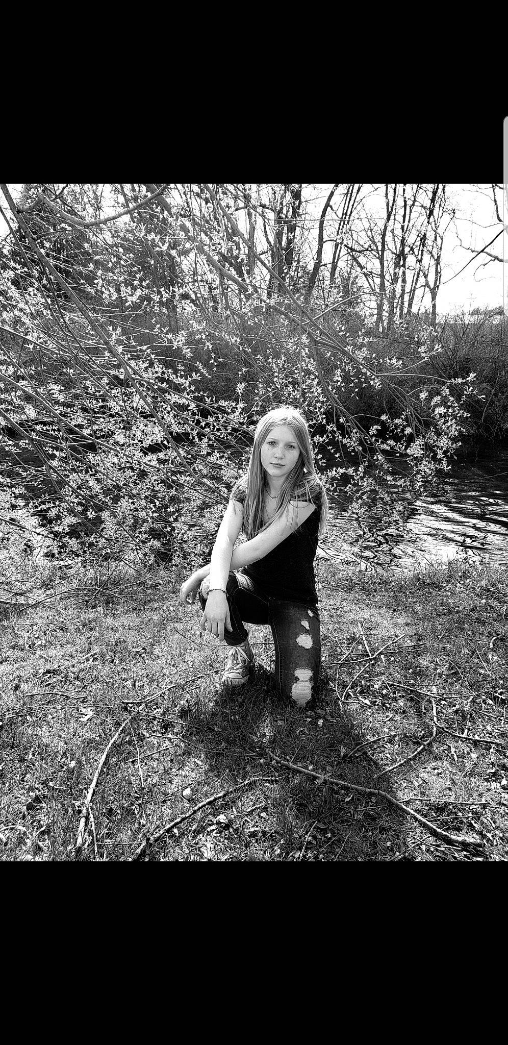 Greenlee is registered to the contest to win money with this photo: black_and_white, blond, branch, forest, grass, monochrome, monochrome_photography, people_in_nature, person, photo_shoot, photograph, photography, plant, portrait, portrait_photography, sitting, smile, snapshot, stock_photography, style