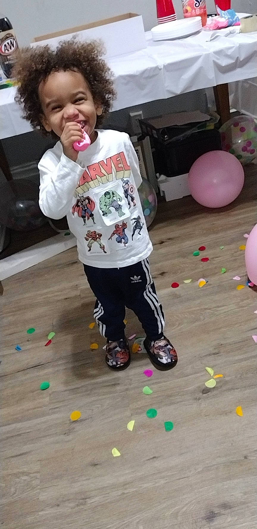 Prince is registered to the contest to win money with this photo: balloon, child, event, floor, flooring, fun, happy, leisure, party_supply, pattern, person, play, recreation, sleeve, smile, snapshot, sweatpant, t_shirt, toddler, white