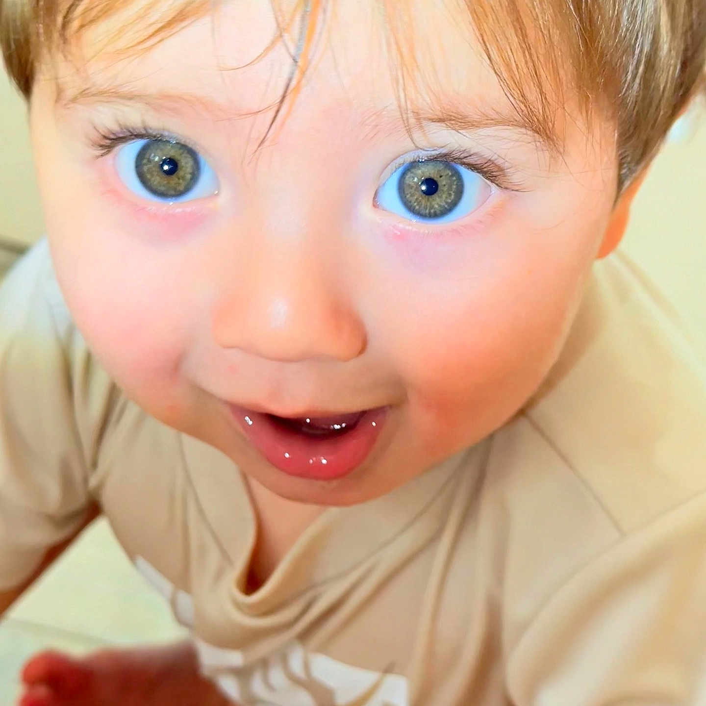 Adam is registered to the contest to win money with this photo: baby, beige_clothing, child, childhood, close_up, curious, cute, expression, eyes, face, hair, happy, indoor, mouth, person, portrait, skin, smiling, toddler, young
