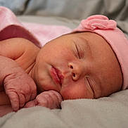 Octavia is registered to the contest to win money with this photo: newborn, baby, sleeping, pink_hat, blanket, closeup, face, infant, soft, cute, peaceful, skin, hand, portrait, rest, tender, wrapped, cozy, child, sleep