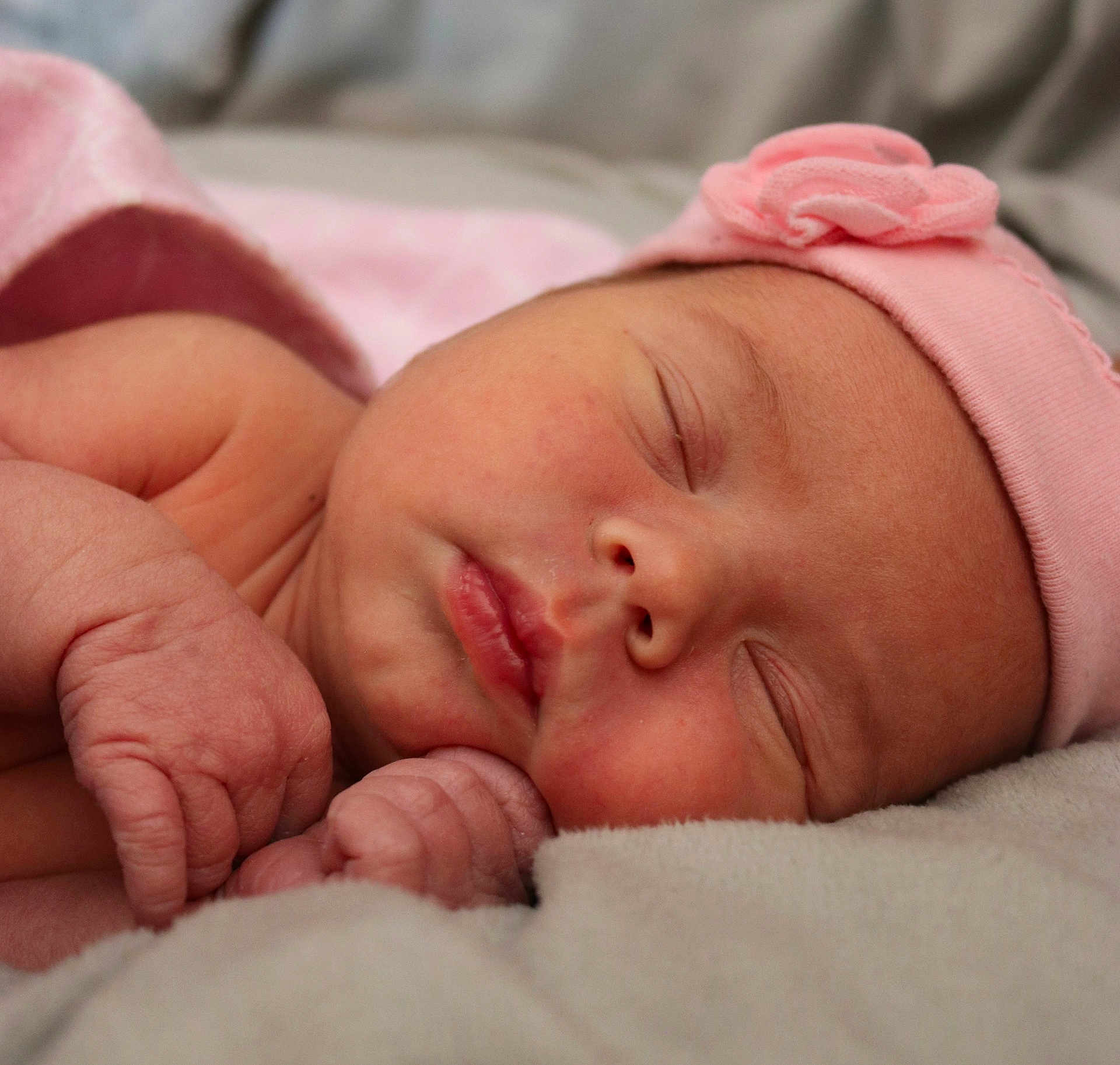 Octavia is registered to the contest to win money with this photo: newborn, baby, sleeping, pink_hat, blanket, closeup, face, infant, soft, cute, peaceful, skin, hand, portrait, rest, tender, wrapped, cozy, child, sleep