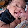 Cayden joined the competition — help win amazing prizes! baby, black_shirt, blanket, child, close_up, cozy, cute, expression, face, hand, happy, indoors, infant, newborn, peaceful, portrait, sleepy, smile, soft_skin, zigzag_pattern