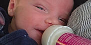 Theodore joined the competition — help win amazing prizes! baby, bottle, feeding, blanket, infant, closeup, face, sleepy, clothing, cute, newborn, resting, comfort, child, soft, striped_blanket, navy, whale_pattern, peaceful, portrait