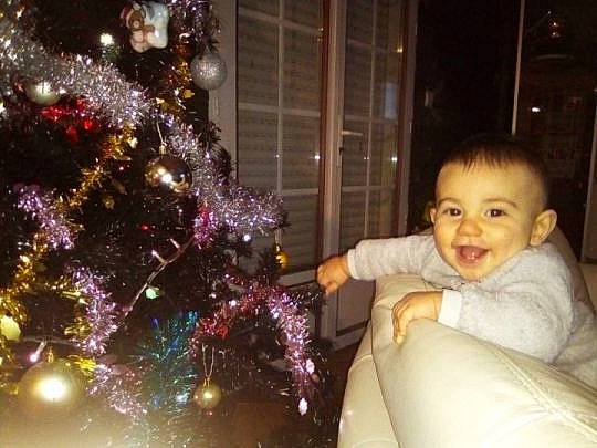 Aedan participe au concours pour gagner de l'argent avec cette photo : christmas, christmas_decoration, christmas_ornament, christmas_tree, decor, event, holiday, joy, lighting, person, toddler, tradition, tree