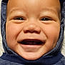 baby, baby_face, blue_clothing, cheerful, child, closeup, cute, expression, face, happy, headwear, hoodie, indoors, infant, person, portrait, skin, smiling, warm_clothing, young_child