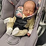 Makenzie is registered to the contest to win money with this photo: baby, newborn, infant_car_seat, car_seat, child, sleeping, seatbelt, pajamas, clothing, face, head, hand, footwear, fabric, pattern, floral, soft, indoors, safety, transportation