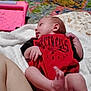 Makenzie is registered to the contest to win money with this photo: baby, infant, blanket, red_clothing, tampa_bay_buccaneers, tablet_case, colorful_quilt, leg, indoors, person, skin, hand, foot, lying_down, bedroom, soft_texture, patterned_fabric, comfort, casual, resting