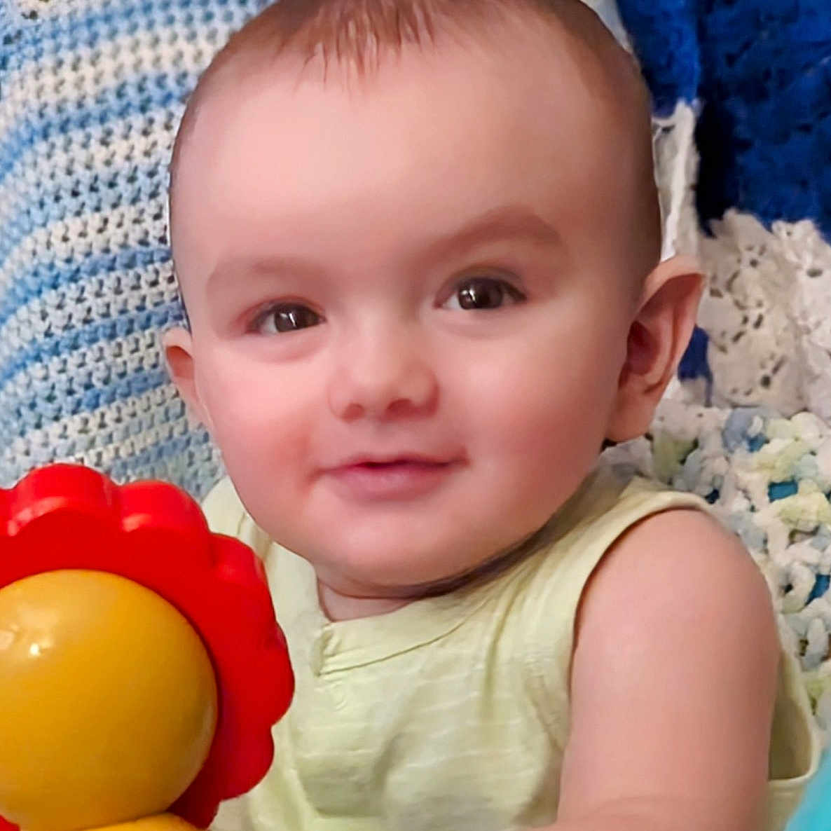 Cygnus is registered to the contest to win money with this photo: baby, bodypart, cap, clothing, couch, cushion, face, finger, furniture, hand, happy, hat, head, homedecor, newborn, person, photography, portrait, smile, toy