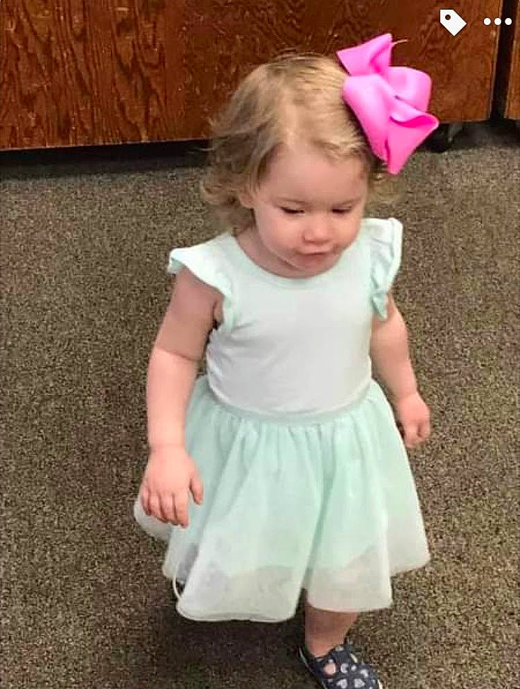 Taytum joined the competition — help win amazing prizes! arm, baby, baby_toddler_clothing, clothing, day_dress, dress, facial_expression, gesture, hair, happy, head, human_body, joint, leg, person, pink, shoulder, skin, sleeve, smile