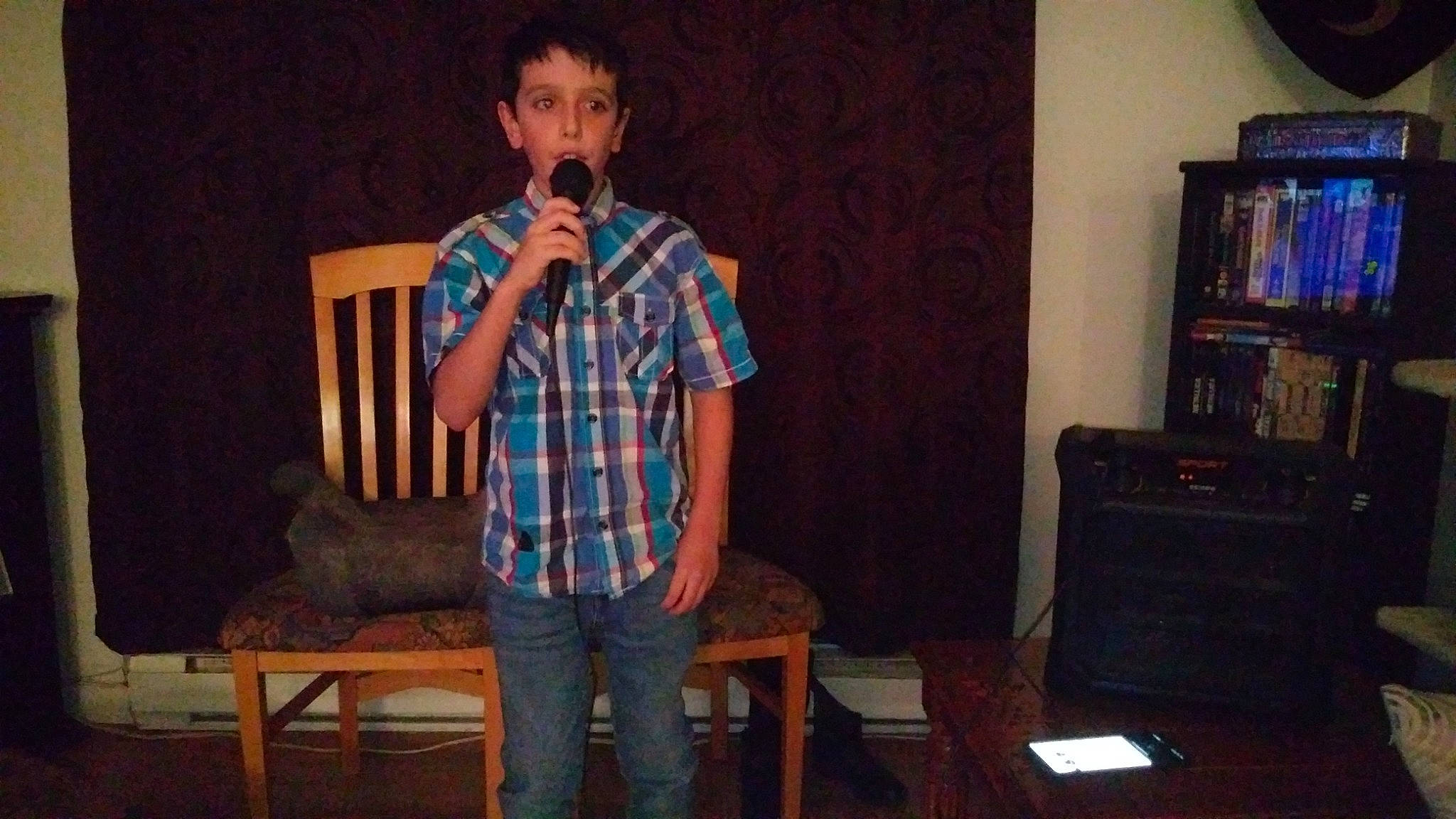 Loik joined the competition — help win amazing prizes! audio_equipment, bookcase, electronic_device, entertainment, event, fun, microphone, music, music_artist, musician, pattern, performing_arts, person, plaid, shelf, speech, standing, stool, t_shirt, tartan