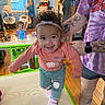 Sage joined the competition — help win amazing prizes! child, toddler, adult, tattoo, table, chair, toy, cup, window, curtain, floor, clothing, headband, smile, indoor, person, furniture, room, baby, wood_floor
