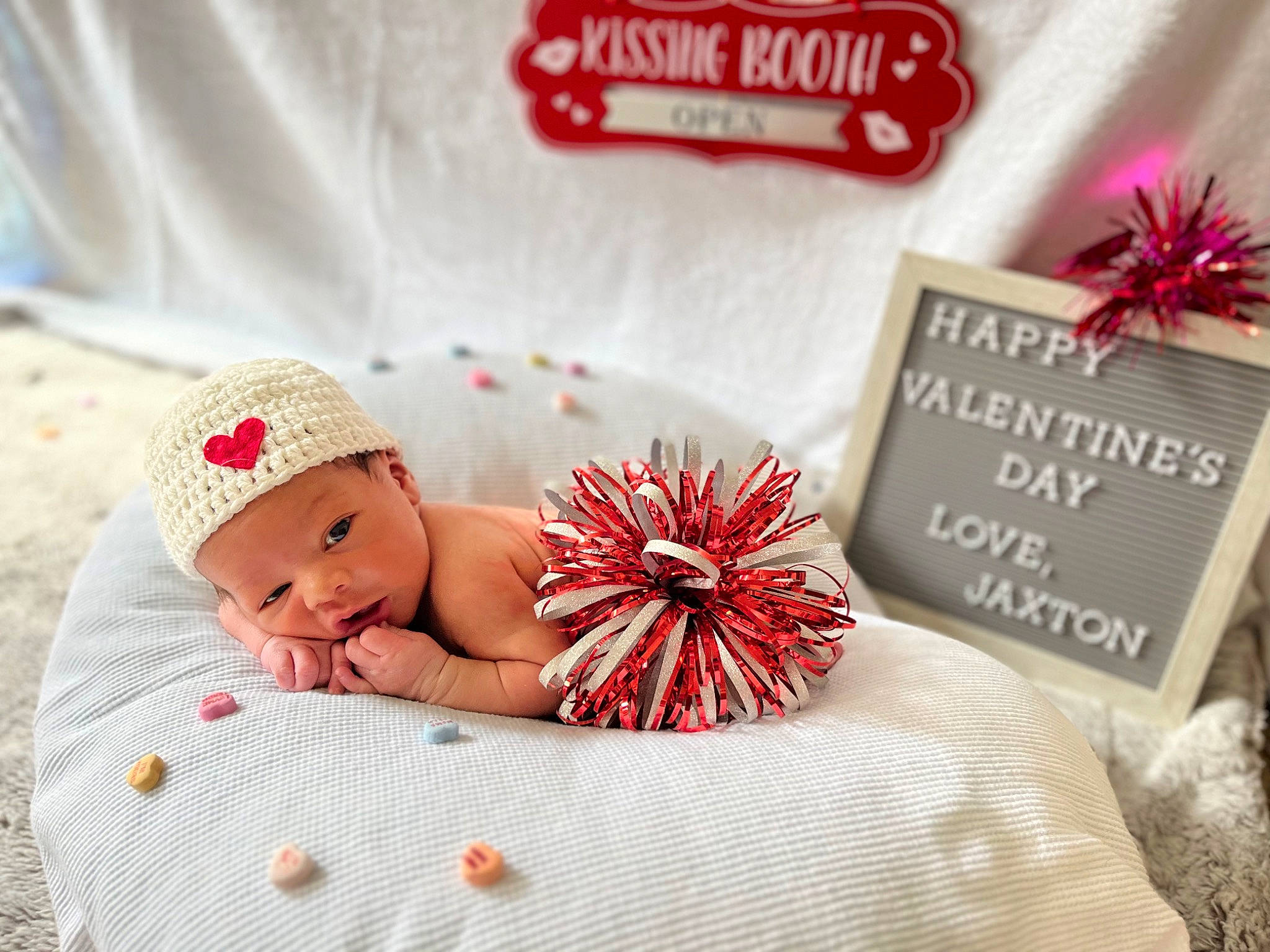 Jaxton is registered to the contest to win money with this photo: baby, baby_sleeping, baby_toddler_clothing, beanie, cap, child, comfort, event, fashion_accessory, font, greeting, happy, headwear, holiday, knit_cap, linens, pattern, person, petal, product