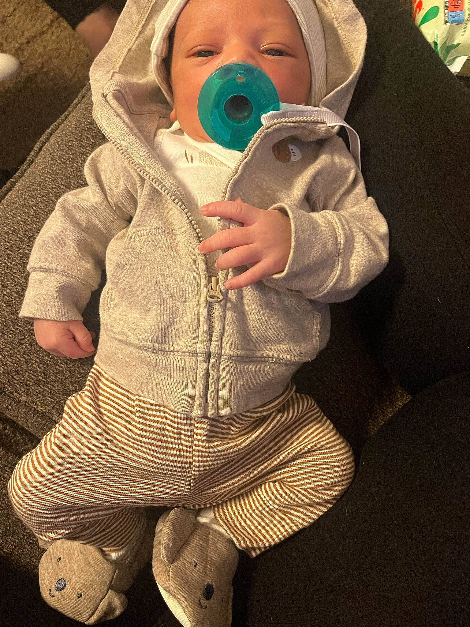 Jaxton is registered to the contest to win money with this photo: baby, baby_products, baby_safety, baby_toddler_clothing, child, comfort, cool, eyelash, eyewear, finger, gesture, hearing, jacket, outerwear, person, personal_protective_equipment, product, sleeve, thumb, toddler