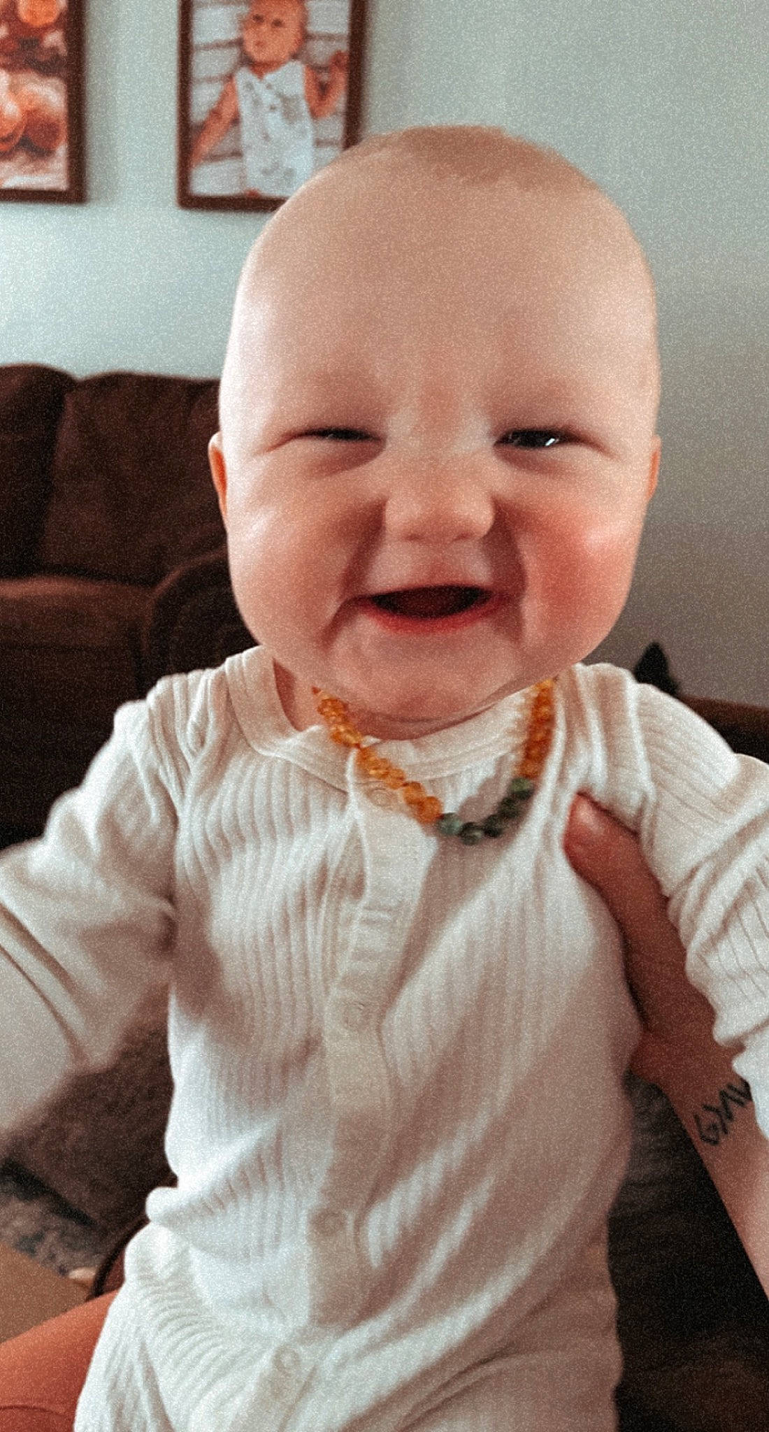 Hollis is registered to the contest to win money with this photo: baby, baby_laughing, baby_toddler_clothing, cheek, comfort, finger, happy, human_body, iris, lip, mouth, neck, nose, outerwear, person, picture_frame, skin, sleeve, smile, textile