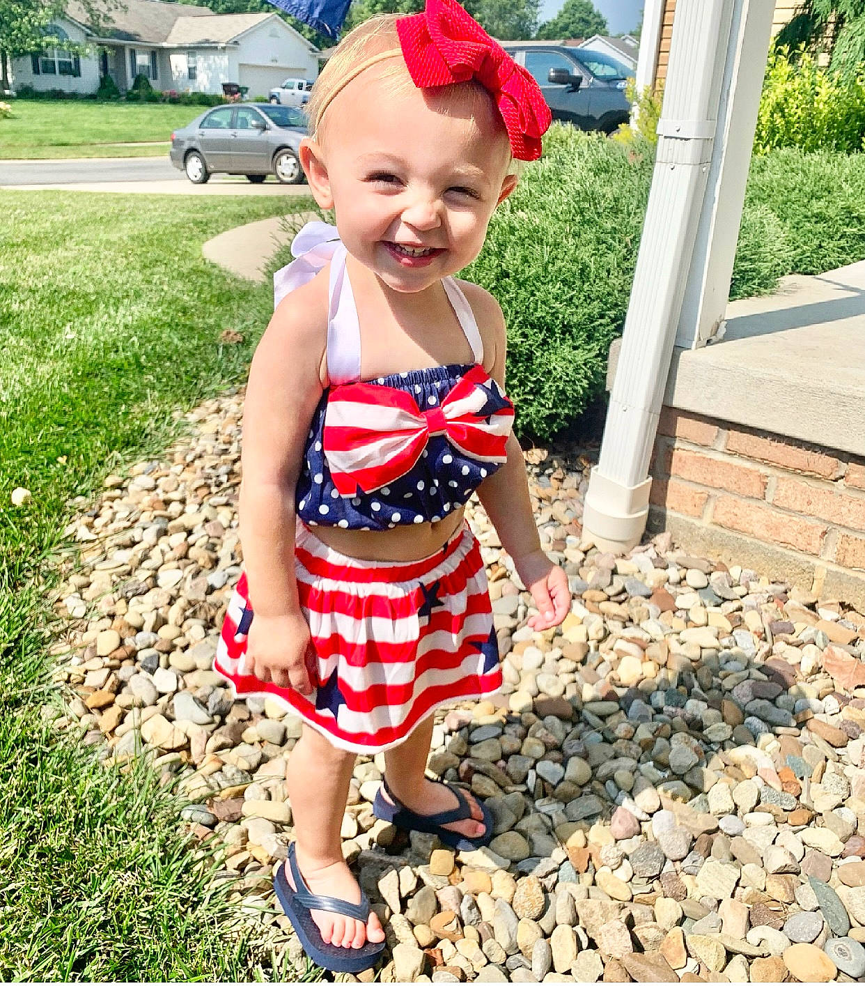 Harper joined the competition — help win amazing prizes! baby_toddler_clothing, beauty, face, grass, green, happy, head, human_leg, joy, leisure, pattern, people_in_nature, person, pink, plant, smile, summer, t_shirt, thigh, toddler