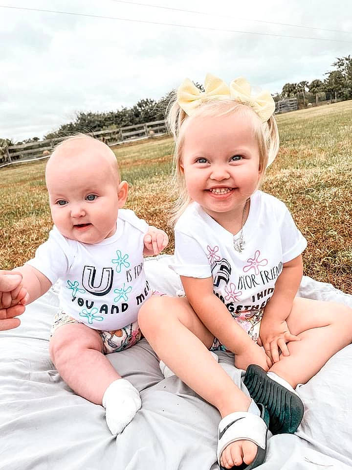 Wrenlee is registered to the contest to win money with this photo: baby, baby_toddler_clothing, cloud, face, flash_photography, gesture, grass, happy, iris, joy, people_in_nature, person, photograph, pink, plant, skin, sky, sleeve, smile, summer