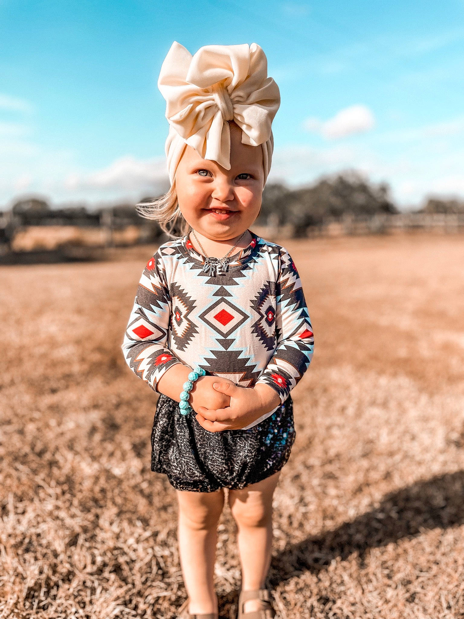 Wrenlee joined the competition — help win amazing prizes! baby_toddler_clothing, beauty, cloud, eye, face, flash_photography, fun, grass, happy, hat, headwear, joy, landscape, natural_environment, people_in_nature, person, sky, sleeve, smile, standing