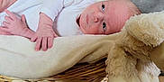 Kaden joined the competition — help win amazing prizes! baby, basket, bed, blanket, crib, face, furniture, happy, head, infantbed, newborn, person, photography, portrait, quilt, sleeping, smile, teddybear, towel, toy