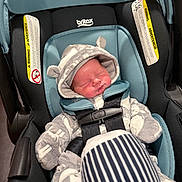 Dakota is registered to the contest to win money with this photo: newborn, baby, car_seat, britax, sleeping, onesie, hood, ears, blanket, striped, infant, child, clothing, seatbelt, safety, cute, indoor, soft, peaceful, resting