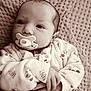 Abigaëlle participe au concours pour gagner de l'argent avec cette photo : baby, blanket, child, closeup, cozy, cute, face, hand, indoors, infant, knitted, monochrome, newborn, pacifier, pajamas, portrait, resting, sepia, sleepy, soft