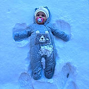 Alaja joined the competition — help win amazing prizes! baby, child, clothing, cold, cute, footprints, frozen, gloves, happy, hat, infant, lying_down, outdoor, pacifier, play, portrait, snow, snow_angel, snowsuit, winter