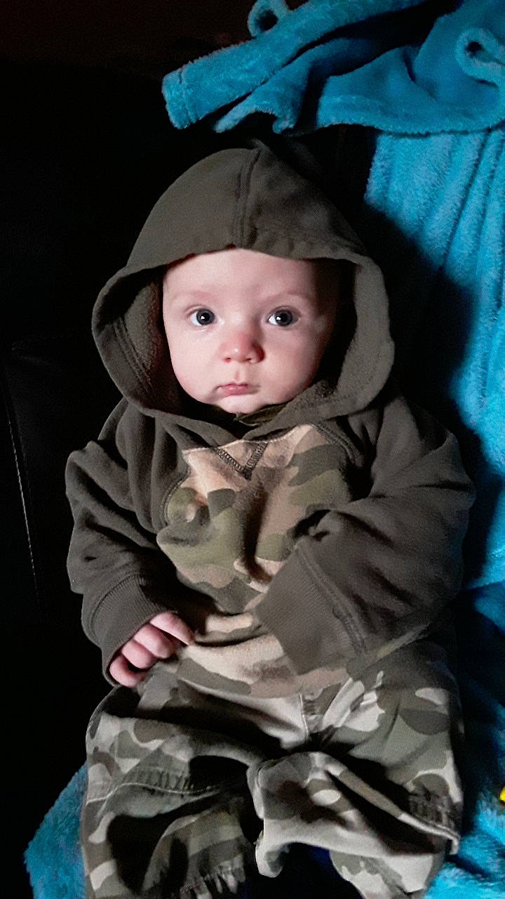 Colson is registered to the contest to win money with this photo: baby, child, child_model, hat, headgear, outerwear, person, photography, toddler