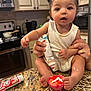 Brooklyn joined the competition — help win amazing prizes! baby, child, kitchen, cupcake, icing, countertop, scissors, baking, food, person, cute, messy, hands, feet, white_clothing, pigtails, kitchen_appliances, adult_hands, sticker_tube, decorated_cupcake