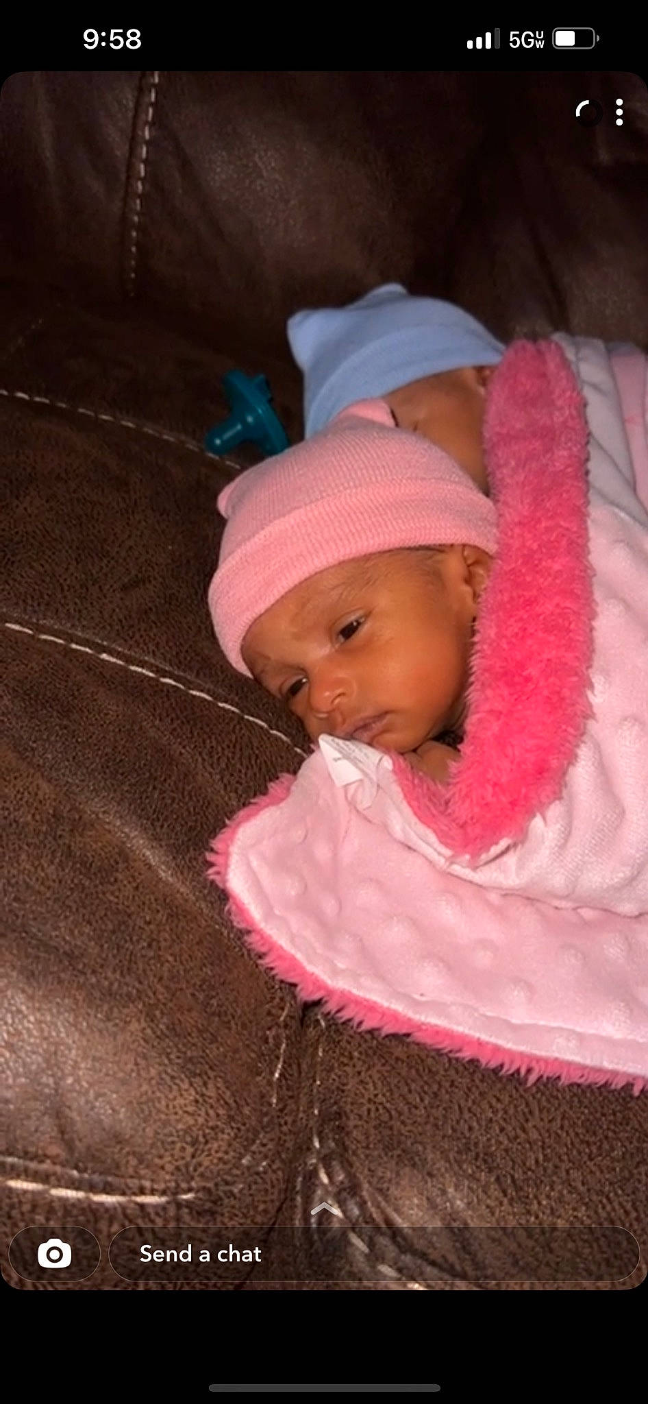 Ivory Coles is registered to the contest to win money with this photo: baby, baby_toddler_clothing, beanie, bonnet, cap, cheek, child, comfort, fashion_accessory, fun, headwear, knit_cap, magenta, nose, person, pink, skin, sleeve, toddler, winter