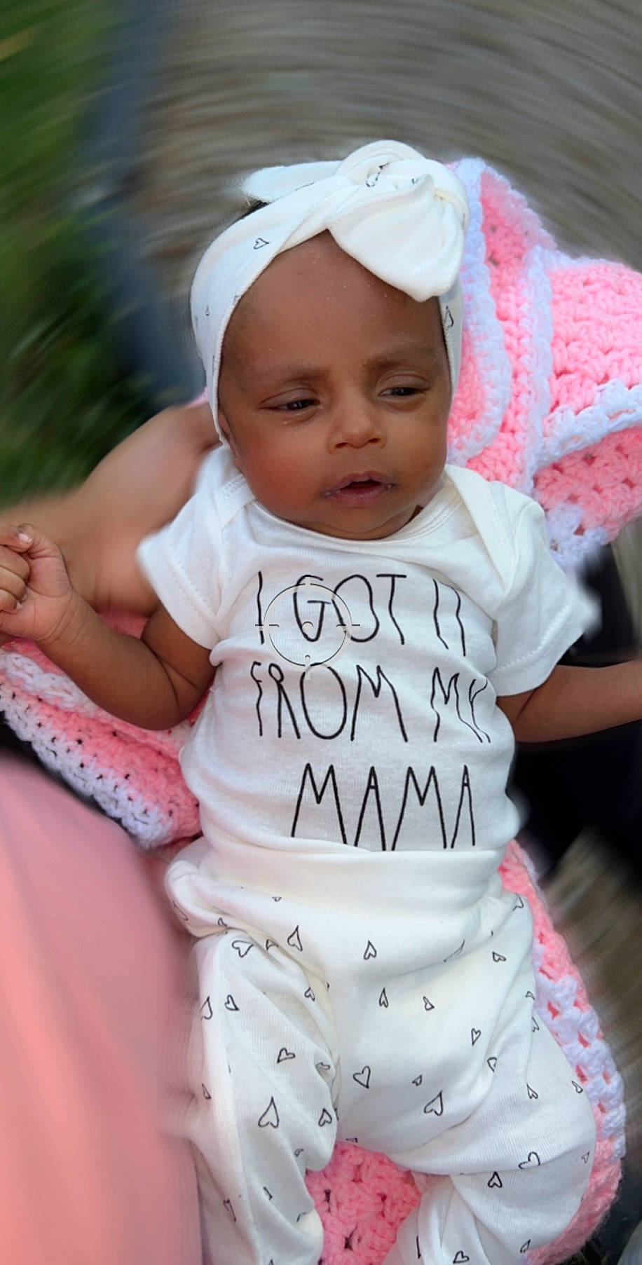 Ivory Coles is registered to the contest to win money with this photo: baby, baby_products, baby_toddler_clothing, beauty, cap, child, event, facial_expression, fashion_accessory, happy, pattern, person, pink, product, recreation, skin, sleeve, smile, t_shirt, toddler