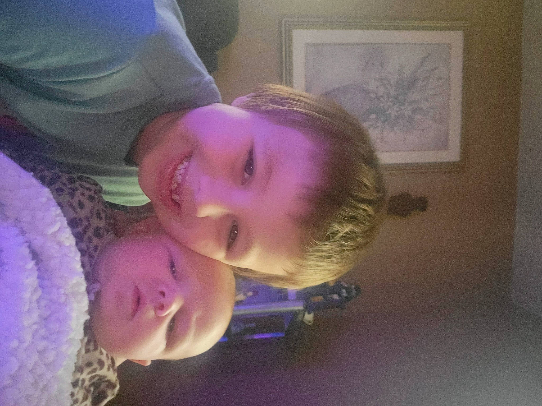 Brahmz is registered to the contest to win money with this photo: cheek, child, ear, eyebrow, eyelash, fun, happy, iris, joy, lip, magenta, mouth, nose, person, picture_frame, pink, purple, room, skin, smile