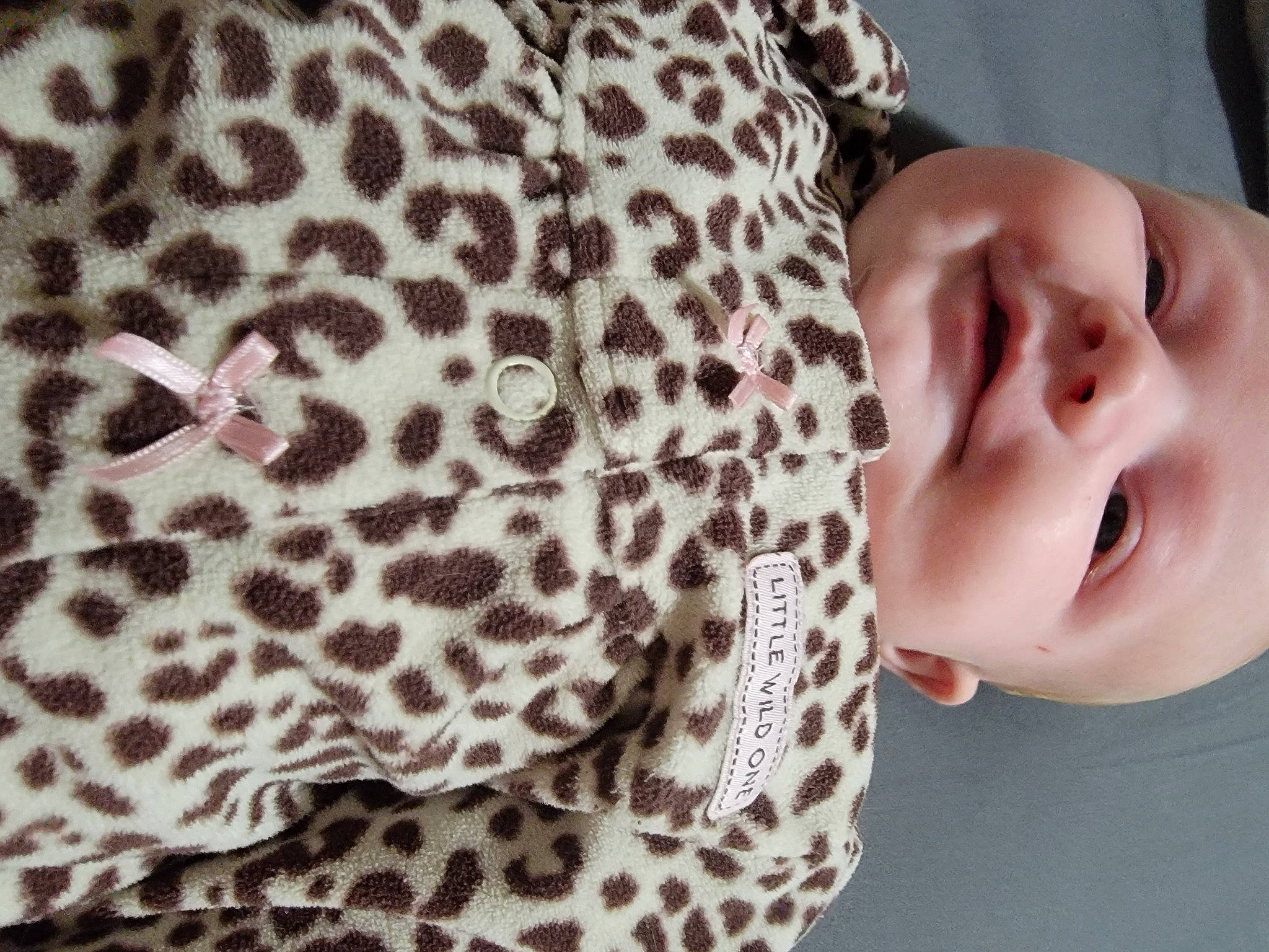 Aurelia is registered to the contest to win money with this photo: baby, baby_toddler_clothing, cheek, comfort, eyelash, fashion_accessory, fur, hairstyle, happy, head, linens, neck, pattern, person, portrait_photography, skin, sleeve, terrestrial_animal, textile, toddler