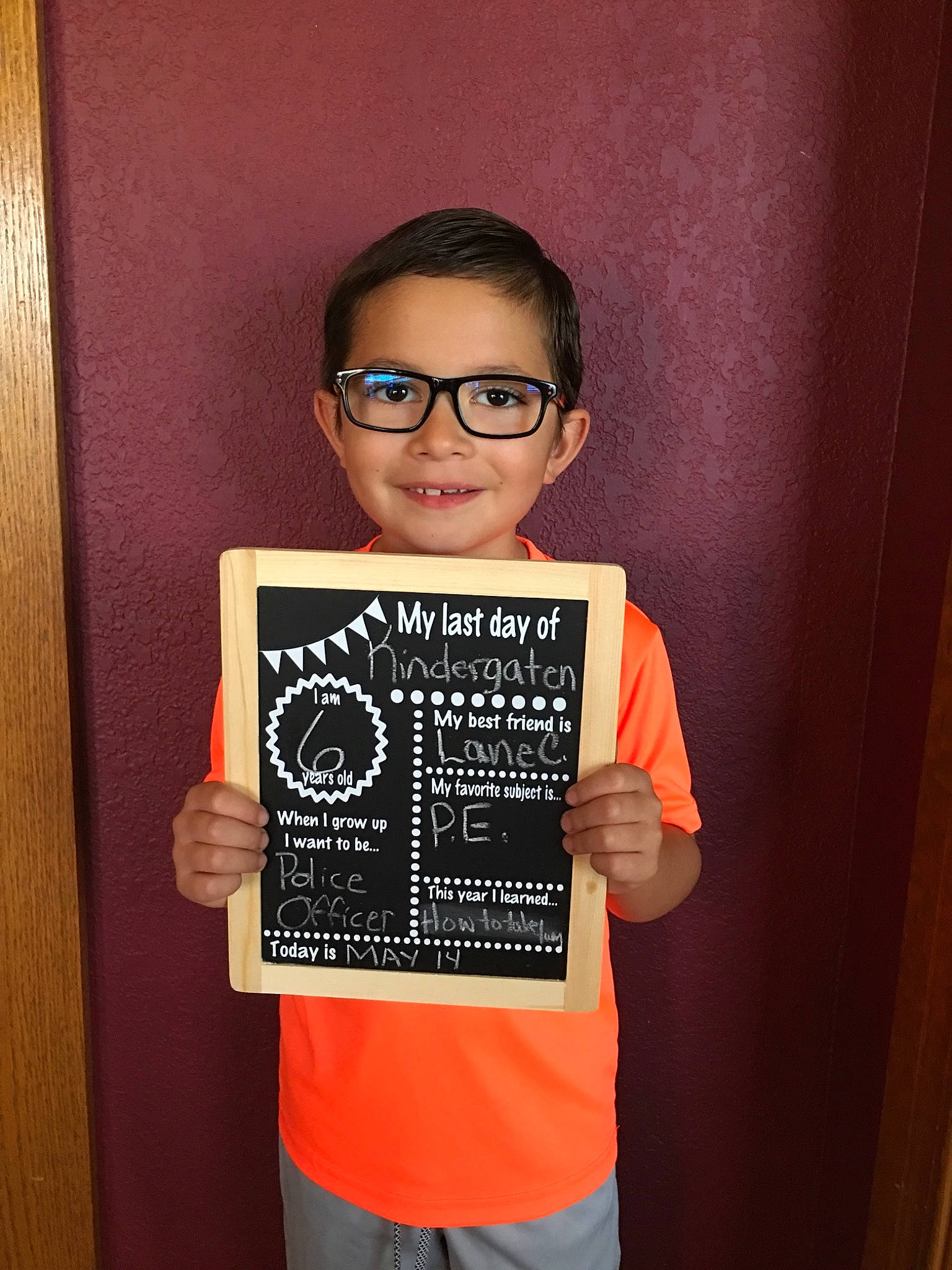 Ayden is registered to the contest to win money with this photo: blackboard, cool, eyewear, glasses, joy, person, smile, t_shirt