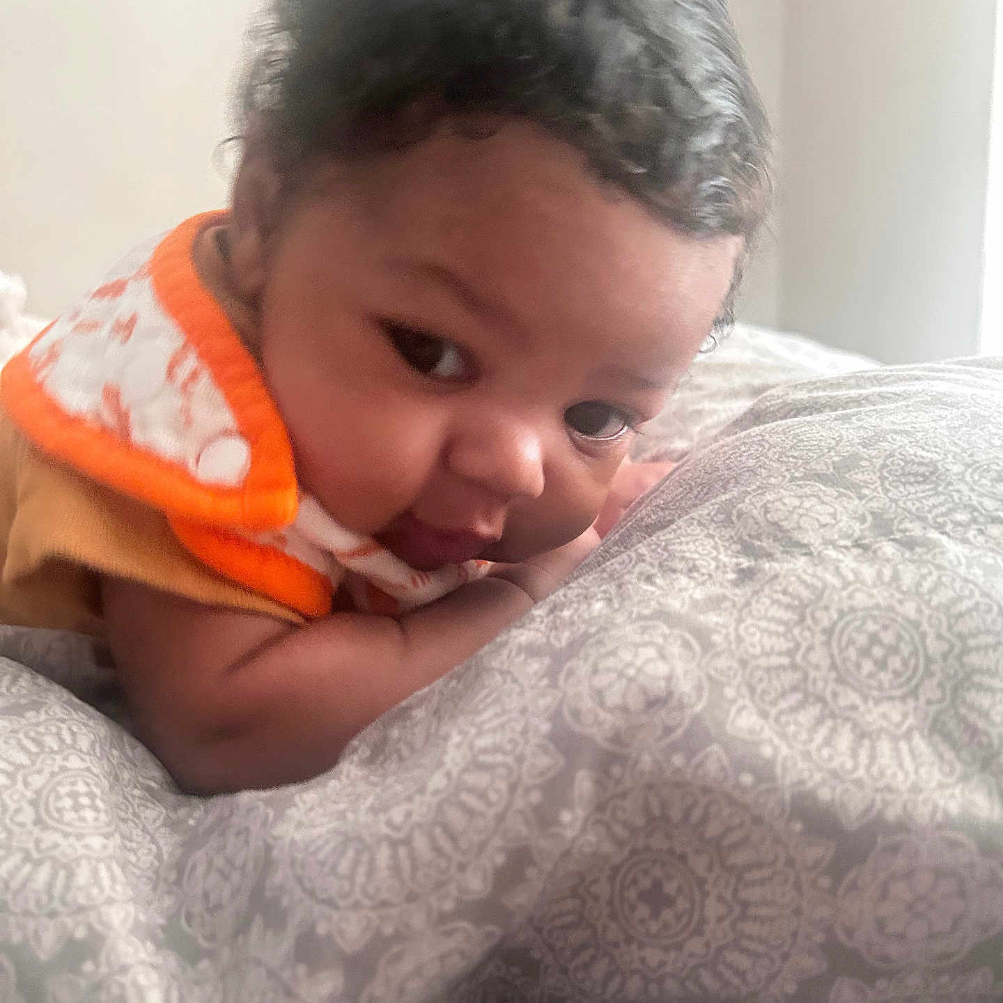 Corey Joseph is registered to the contest to win money with this photo: baby, babylaughing, bed, bedroom, blanket, bodypart, cushion, face, finger, furniture, hand, happy, head, homedecor, newborn, person, photography, portrait, quilt, smile