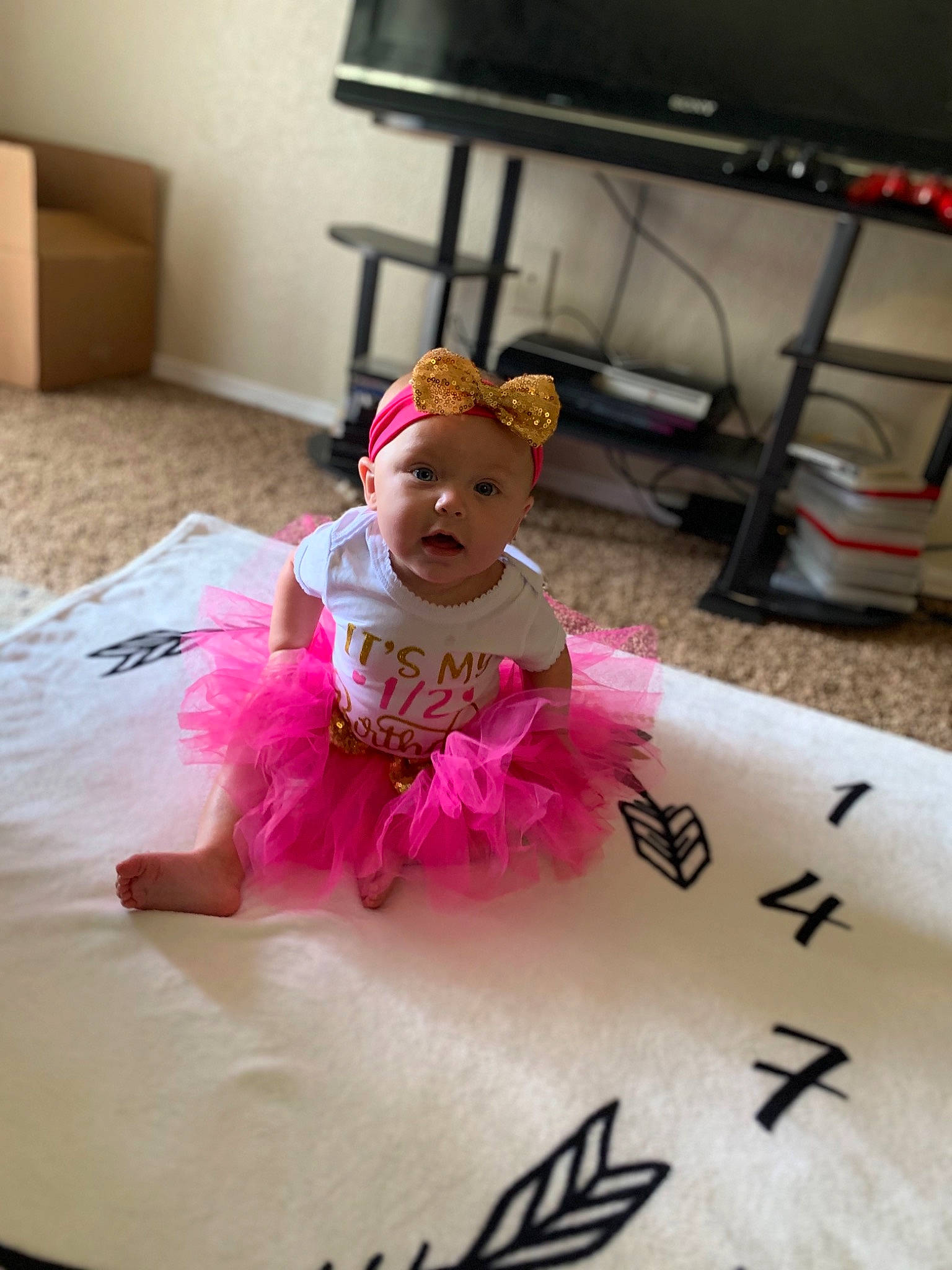 Lylah is registered to the contest to win money with this photo: baby, ballet_tutu, child, costume, headwear, party, person, pink, surprise, toddler