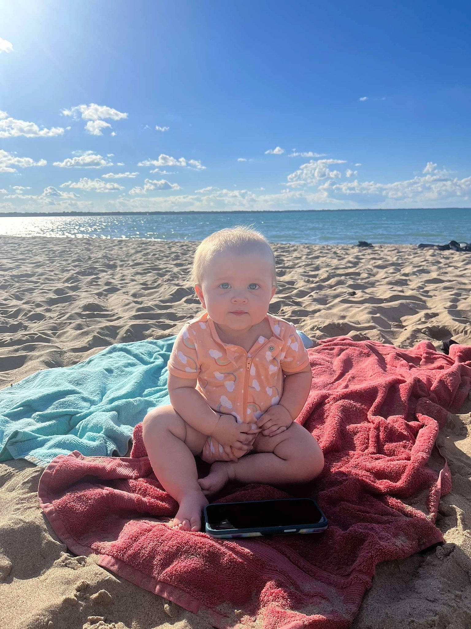 Ivy is registered to the contest to win money with this photo: azure, baby, baby_toddler_clothing, beach, beauty, cloud, coastal_and_oceanic_landforms, flash_photography, fun, horizon, leg, mammal, people_in_nature, person, sand, shore, sky, toddler, vertebrate, water