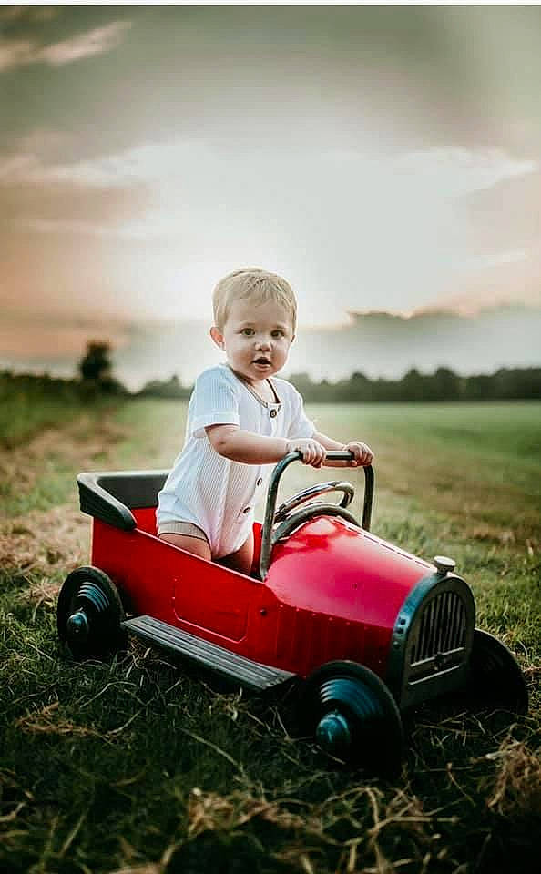 Caysen joined the competition — help win amazing prizes! child, fun, grass, grassland, happy, person, photography, plant, play, riding_toy, sitting, stock_photography, toddler, vehicle