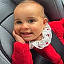 baby, baby_girl, car_seat, child, child_seat, closeup, clothing, cute, face, hand, happy, head, indoor, infant, person, portrait, red_sweater, seatbelt, smiling, young_child
