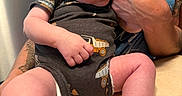 Astonn joined the competition — help win amazing prizes! newborn, baby, infant, sleeping, portrait, person, adult, holding, arms, onesie, truck_pattern, barefoot, face, closed_eyes, indoors, kitchen, countertop, refrigerator, tattoo, family