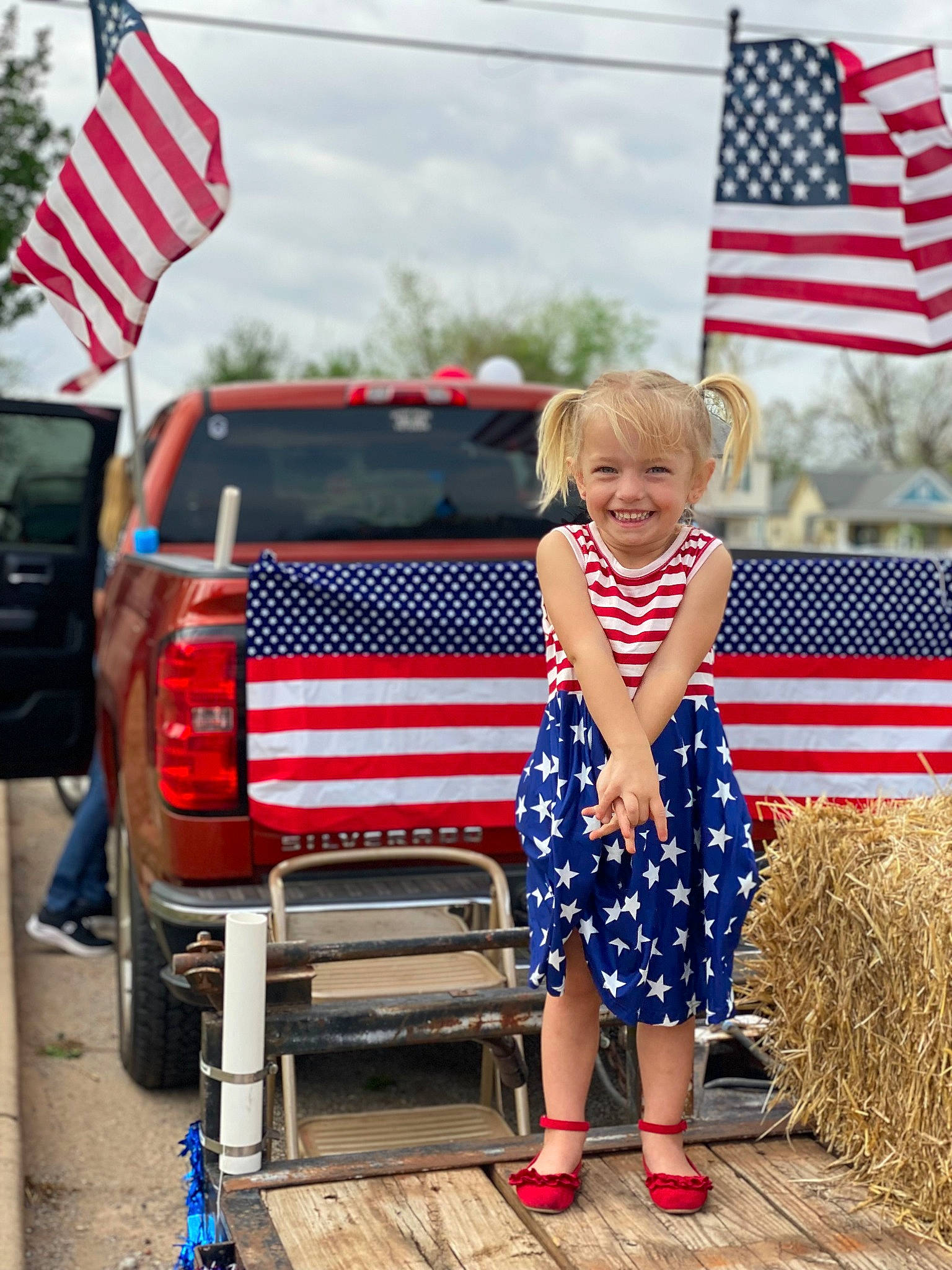 Mava joined the competition — help win amazing prizes! automotive_exterior, blue, bumper, car, cloud, electric_blue, event, flag, flag_day_usa, flag_of_the_united_states, joy, motor_vehicle, pattern, person, red, shoe, sky, smile, toddler, trunk
