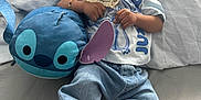 Chōzyn joined the competition — help win amazing prizes! baby, infant, pacifier, plush_toy, stitch, denim_jeans, sneakers, white_shirt, bed, pillow, cute, child, lying_down, bracelet, indoor, soft_toy, casual_clothing, footwear, small_child, adorable